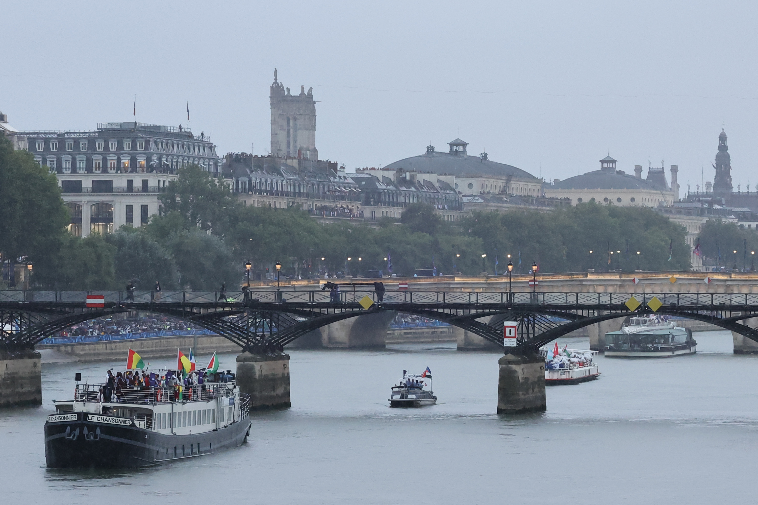 PARIS, FRANCE - JULY 26: A general view of a boat parading athletes along the River Seine during the opening ceremony of the Olympic Games Paris 2024 on July 26, 2024 in Paris, France. (Photo by Arturo Holmes/Getty Images)