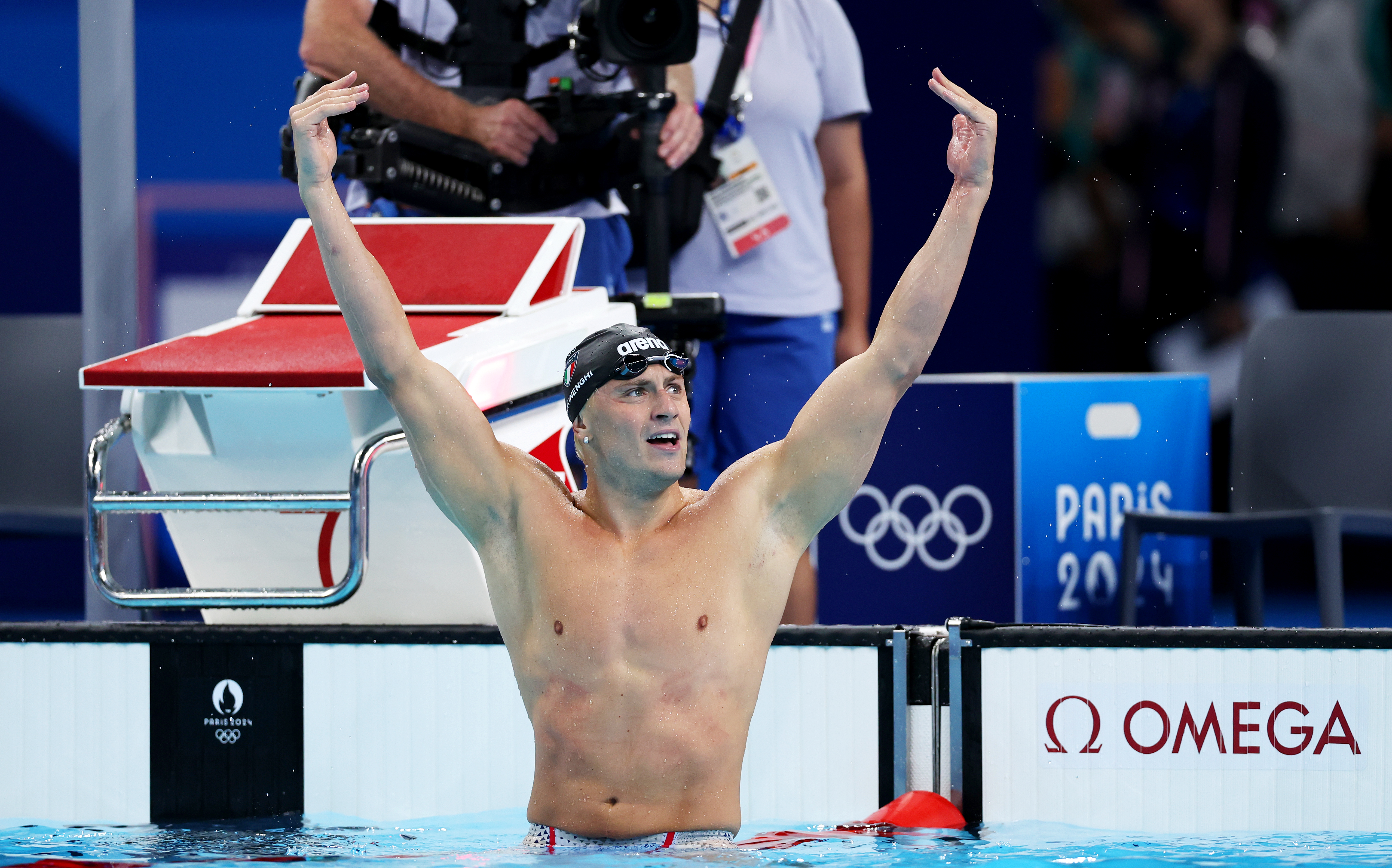 NANTERRE, FRANCE - JULY 28: Nicolo Martinenghi of Team Italy celebrates after winning gold in the Men?s 100m Breaststroke Final on day two of the Olympic Games Paris 2024 at Paris La Defense Arena on July 28, 2024 in Nanterre, France. (Photo by Quinn Rooney/Getty Images)
