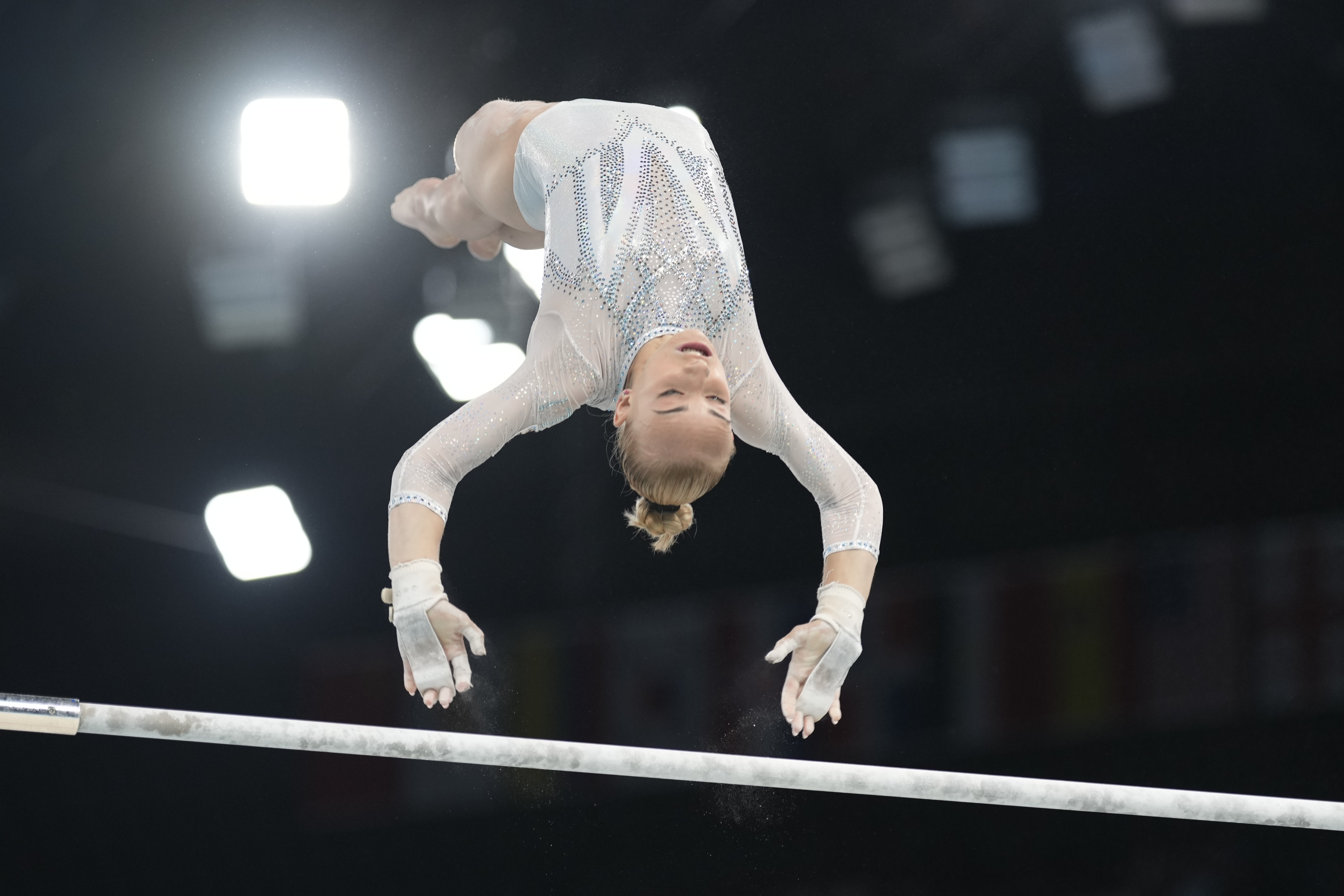 Alice D'Amato, of Italy, performs on the uneven bars during the women's artistic gymnastics team finals round at Bercy Arena at the 2024 Summer Olympics, Tuesday, July 30, 2024, in Paris, France. (AP Photo/Charlie Riedel)