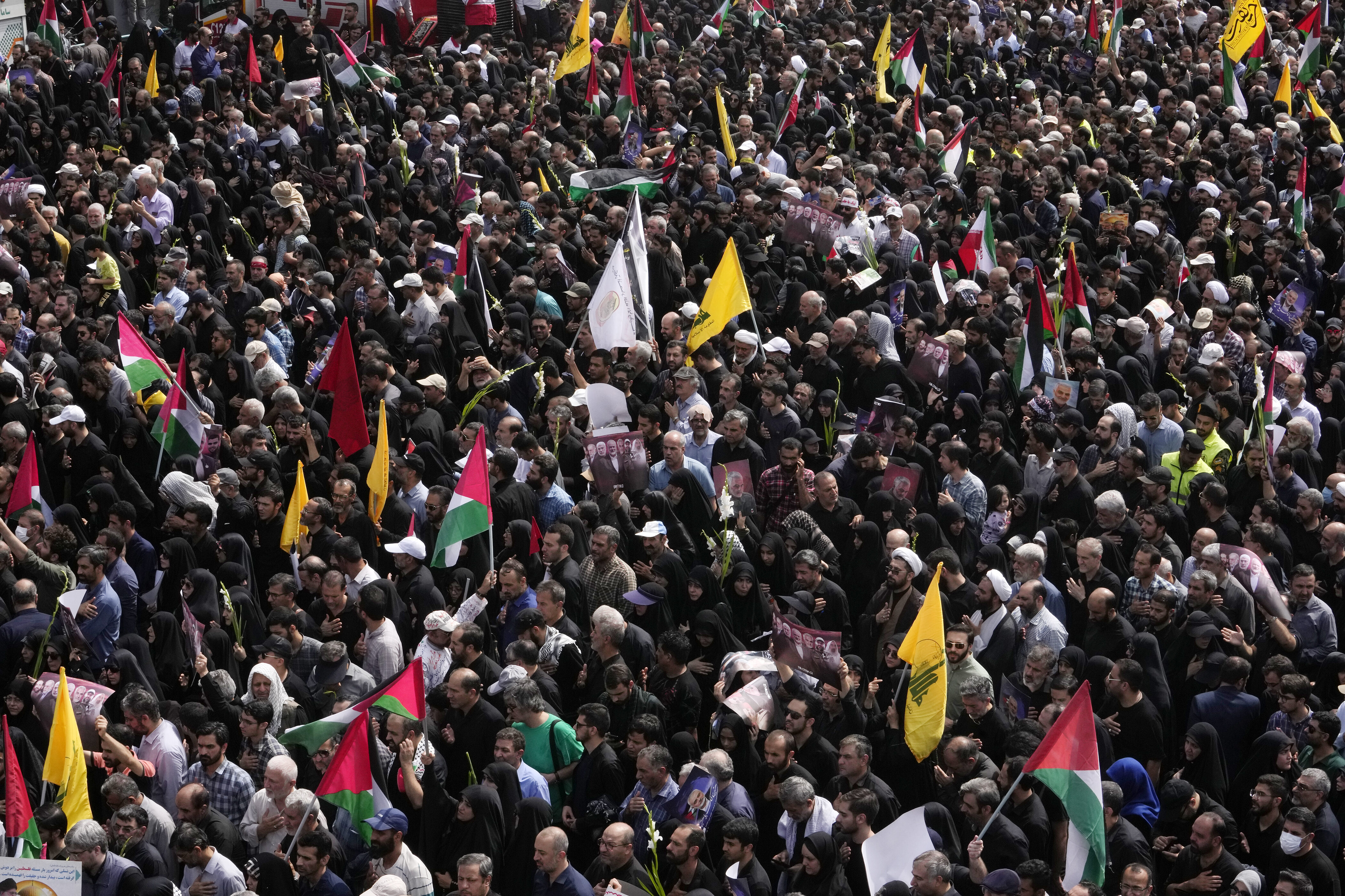 Iranians gather for the funeral ceremony of Hamas leader Ismail Haniyeh and his bodyguard who were killed in an assassination blamed on Israel, Wednesday, at Enqelab-e-Eslami (Islamic Revolution) Sq. in Tehran, Iran, Thursday, Aug. 1, 2024. (AP Photo/Vahid Salemi)