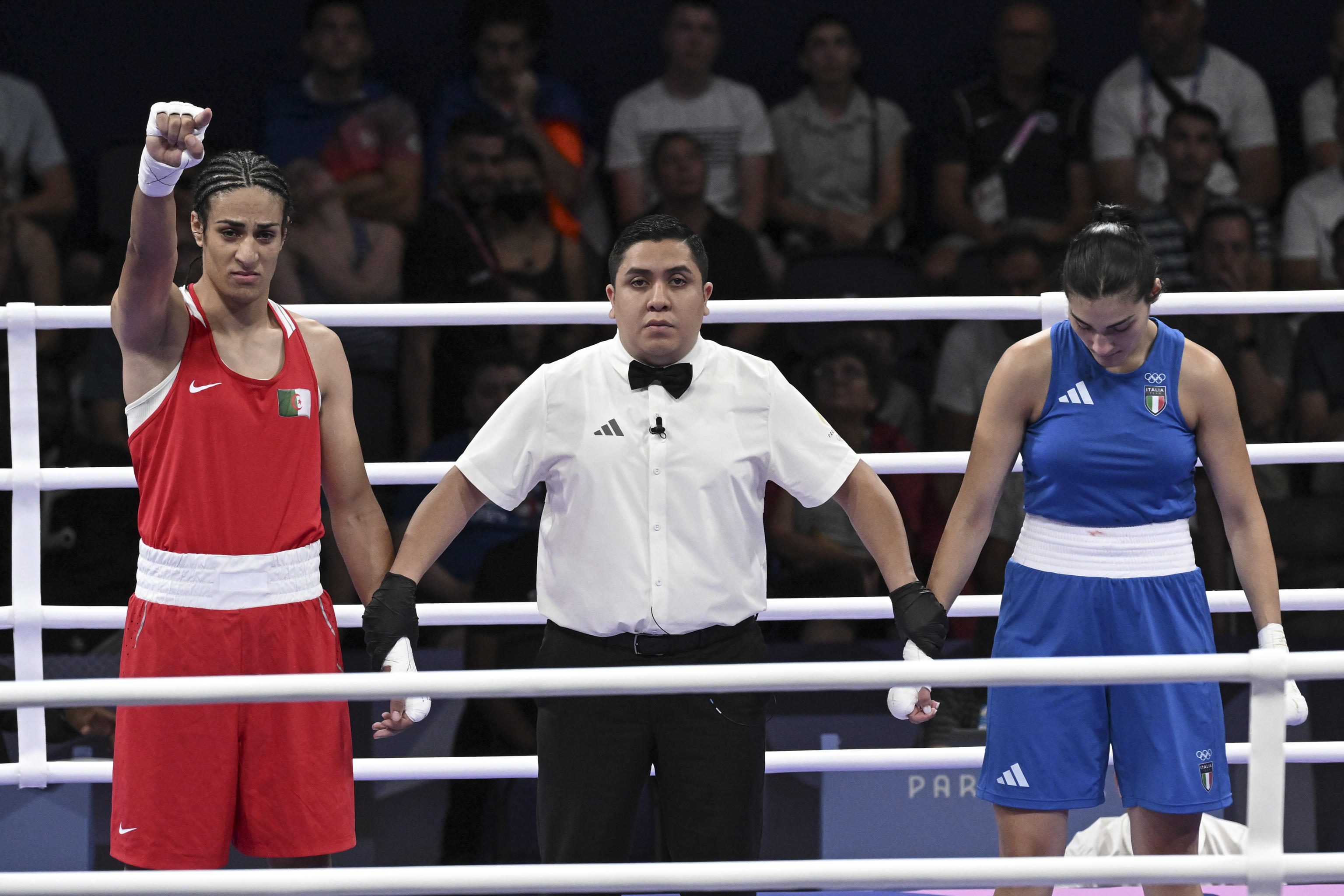 Imane Khelif  of Algeria  ( Red) Angela Carini  of Italy ( Blue) in action during their women's 66kg preliminar round of 16 bout of the Boxing competitions in the Paris 2024 Olympic Games, at the North Paris Arena in Villepinte, France,  1 August 2024 . ANSA / CIRO FUSCO