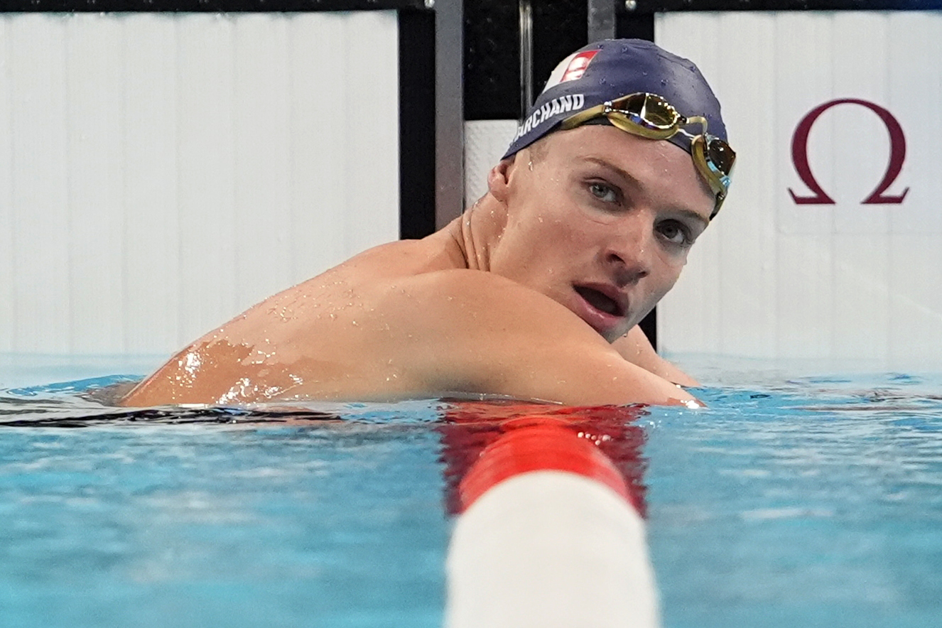 Leon Marchand, of France, reacts following his men's 200-meter individual medley semifinal at the 2024 Summer Olympics, Thursday, Aug. 1, 2024, in Nanterre, France. (AP Photo/Matthias Schrader)