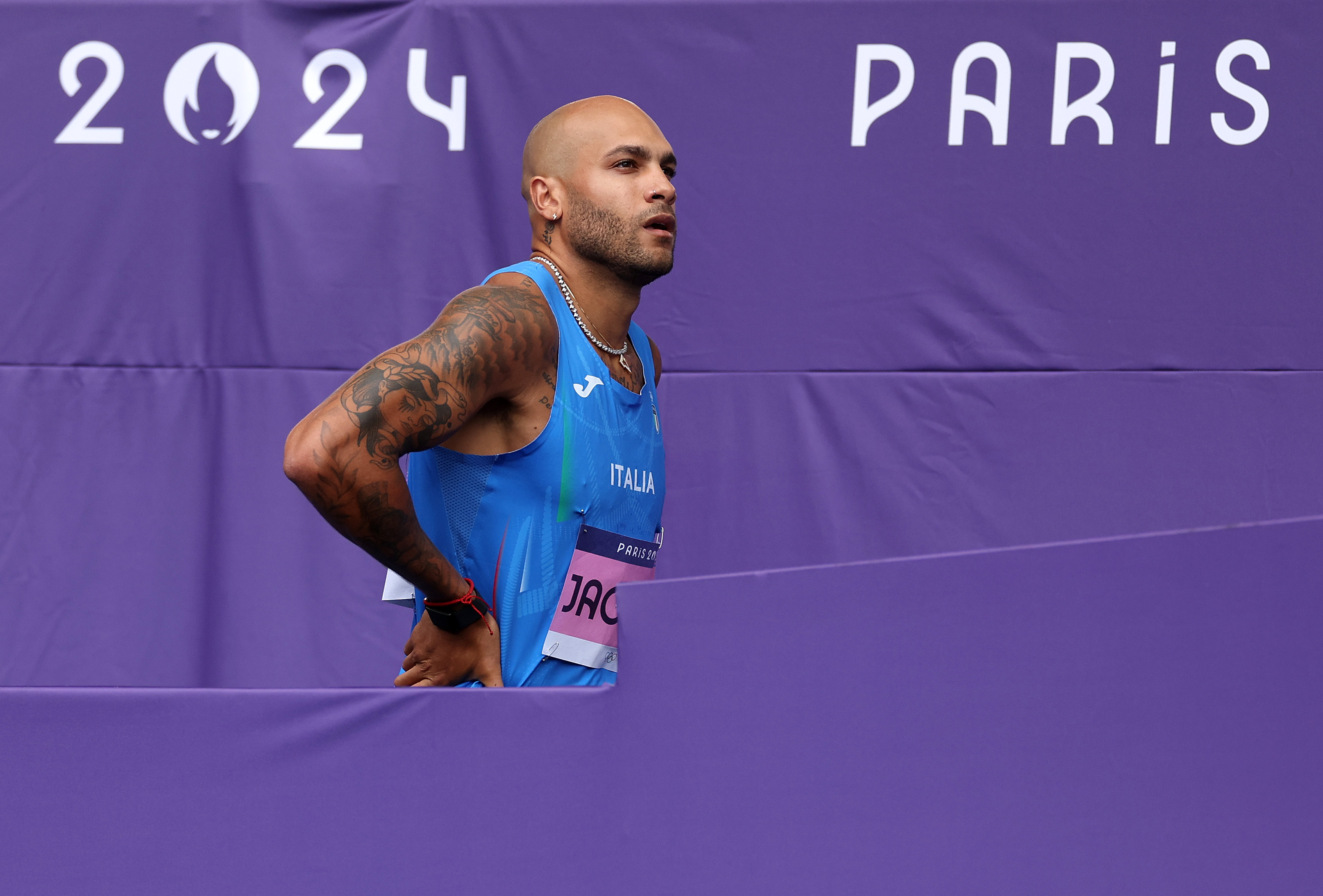 PARIS, FRANCE - AUGUST 03: Lamont Marcell Jacobs of Team Italy looks on during the Men's 100m Round 1 on day eight of the Olympic Games Paris 2024 at Stade de France on August 03, 2024 in Paris, France. (Photo by Michael Steele/Getty Images)