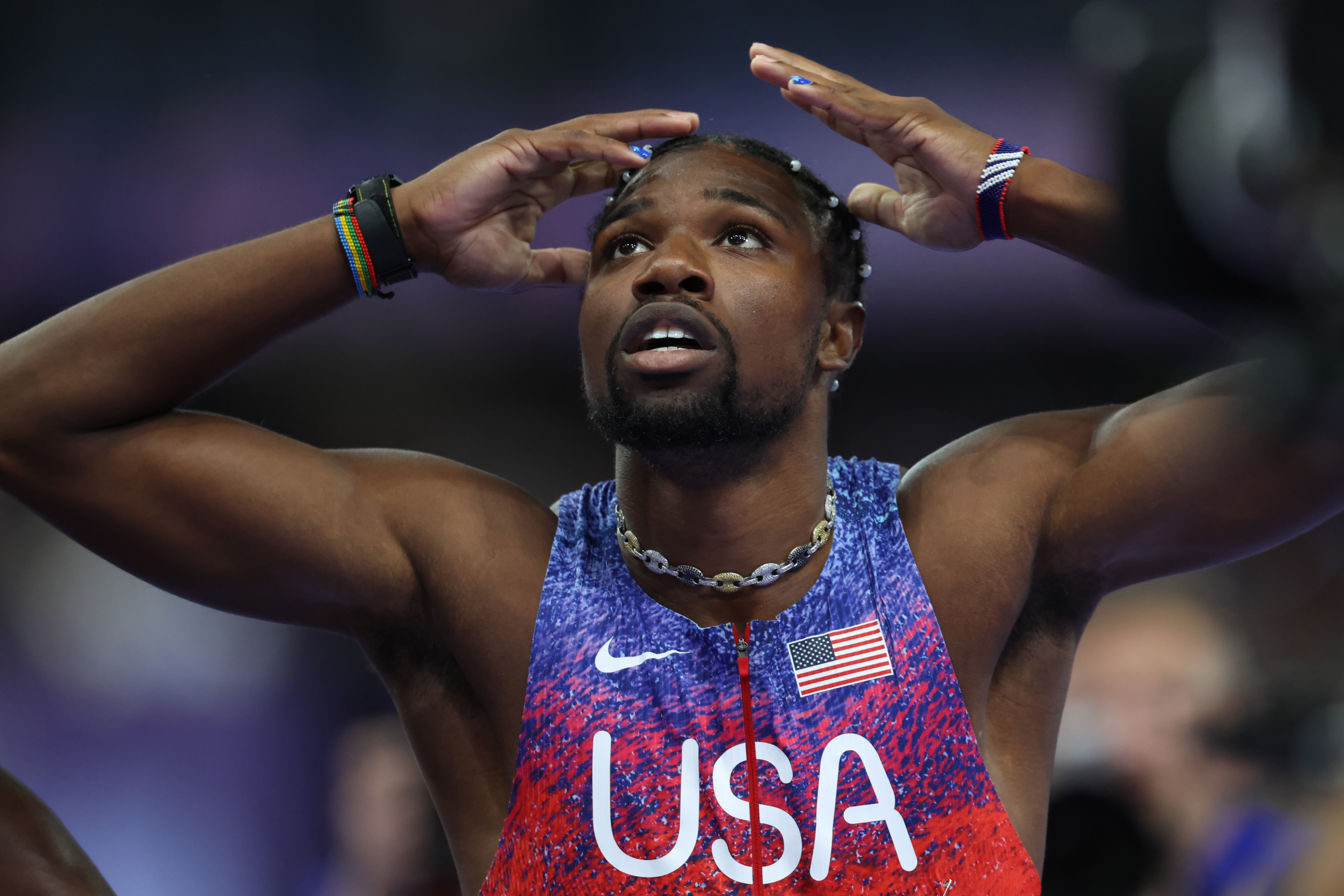 PARIS, FRANCE - AUGUST 04: Noah Lyles of Team United States  reacts after competing in the Men's 100m Final on day nine of the Olympic Games Paris 2024 at Stade de France on August 04, 2024 in Paris, France. (Photo by Pascal Le Segretain/Getty Images)