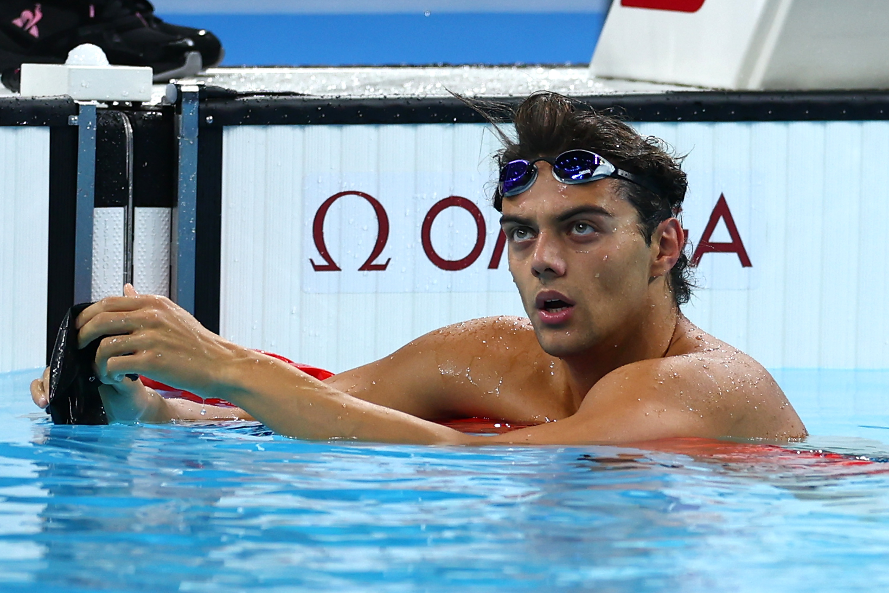 NANTERRE, FRANCE - JULY 28: Thomas Ceccon of Team Italy reacts after competing in the Men's 100m Backstroke Heats on day two of the Olympic Games Paris 2024 at Paris La Defense Arena on July 28, 2024 in Nanterre, France. (Photo by Maddie Meyer/Getty Images)