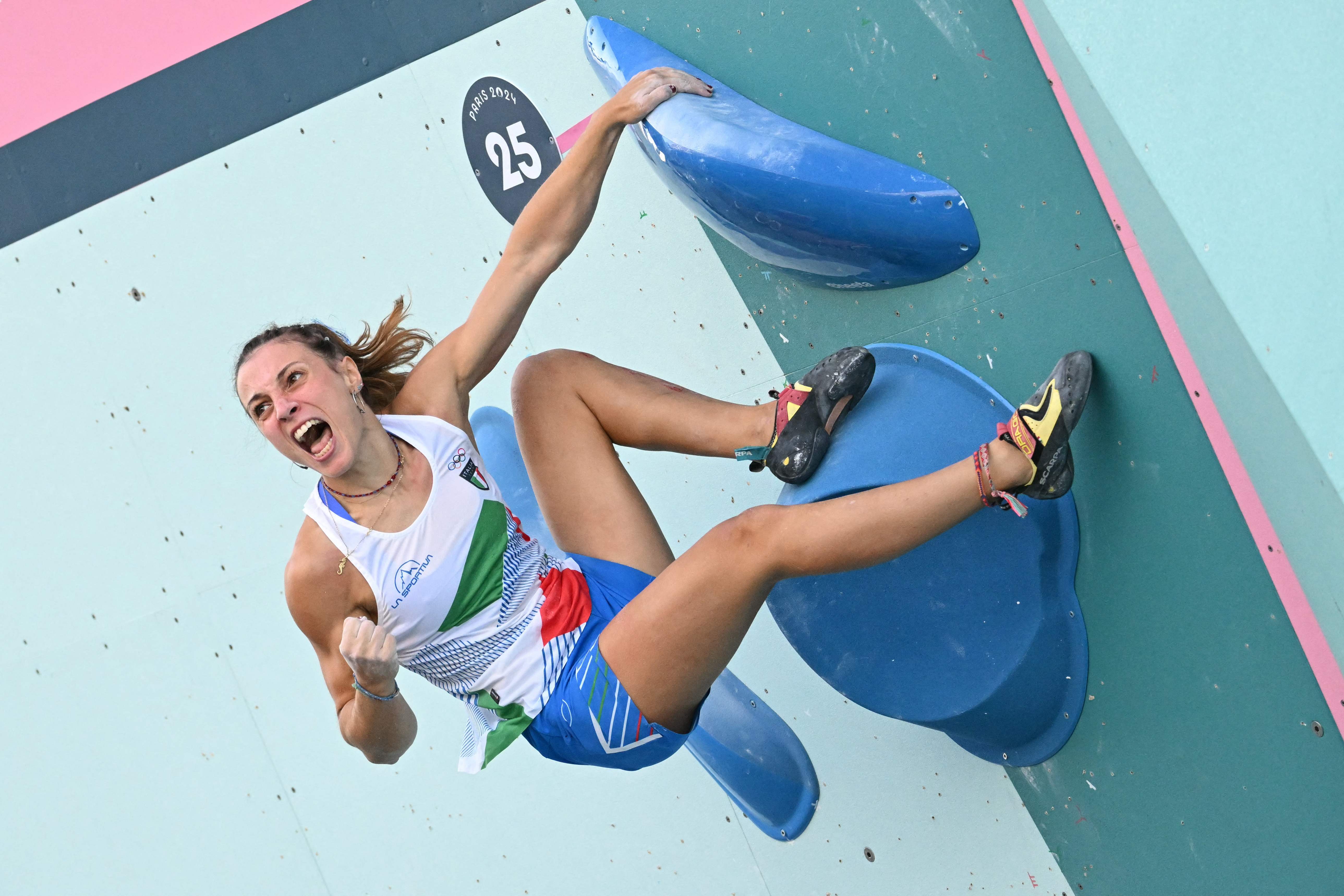Italy's Camilla Moroni competes in the women's sport climbing boulder semi final during the Paris 2024 Olympic Games at Le Bourget Sport Climbing Venue in Le Bourget on August 6, 2024. (Photo by Jonathan NACKSTRAND / AFP)