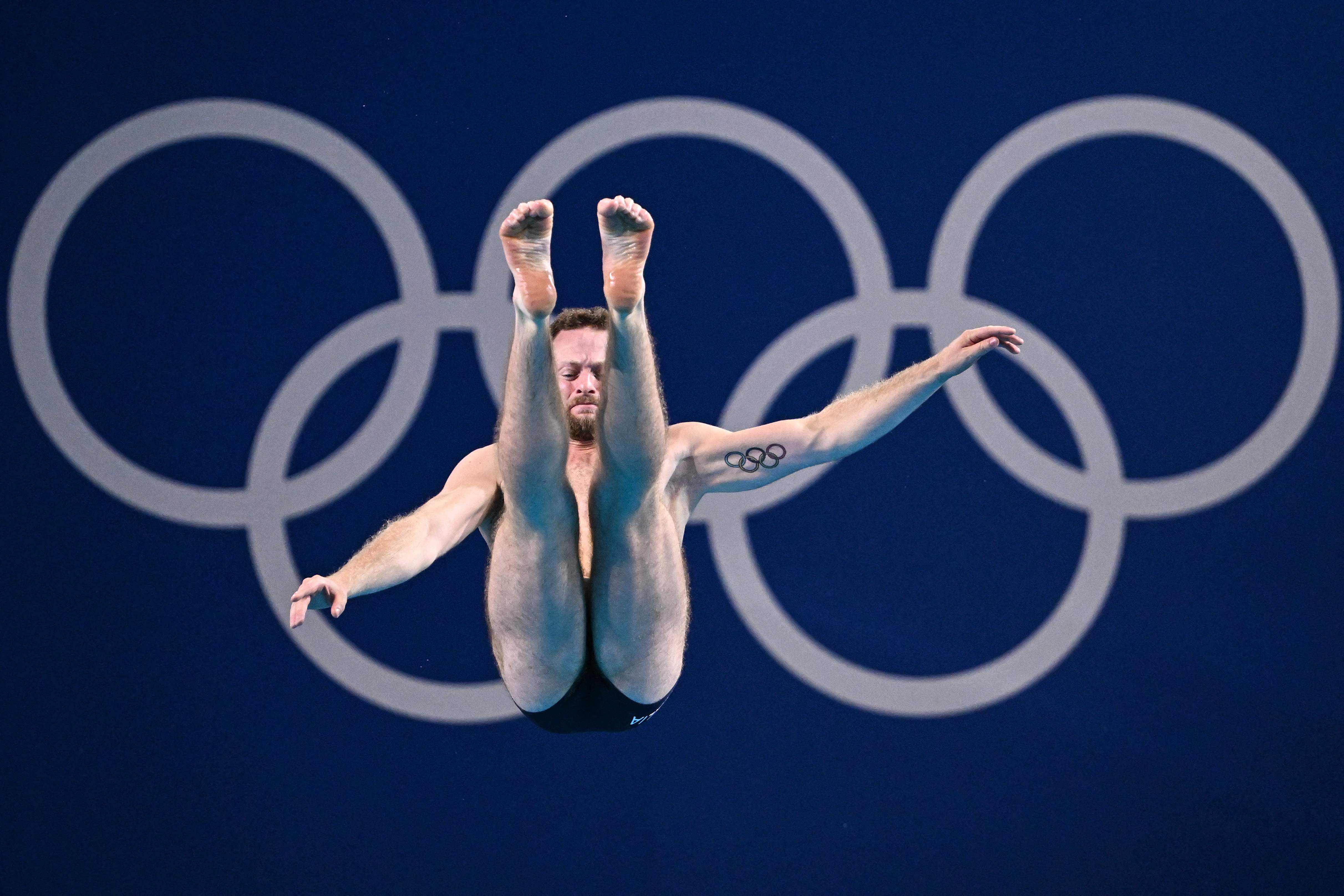 Italy's Lorenzo Marsaglia competes in the men's 3m springboard diving preliminary during the Paris 2024 Olympic Games at the Aquatics Centre in Saint-Denis, north of Paris, on August 6, 2024. (Photo by Manan VATSYAYANA / AFP)