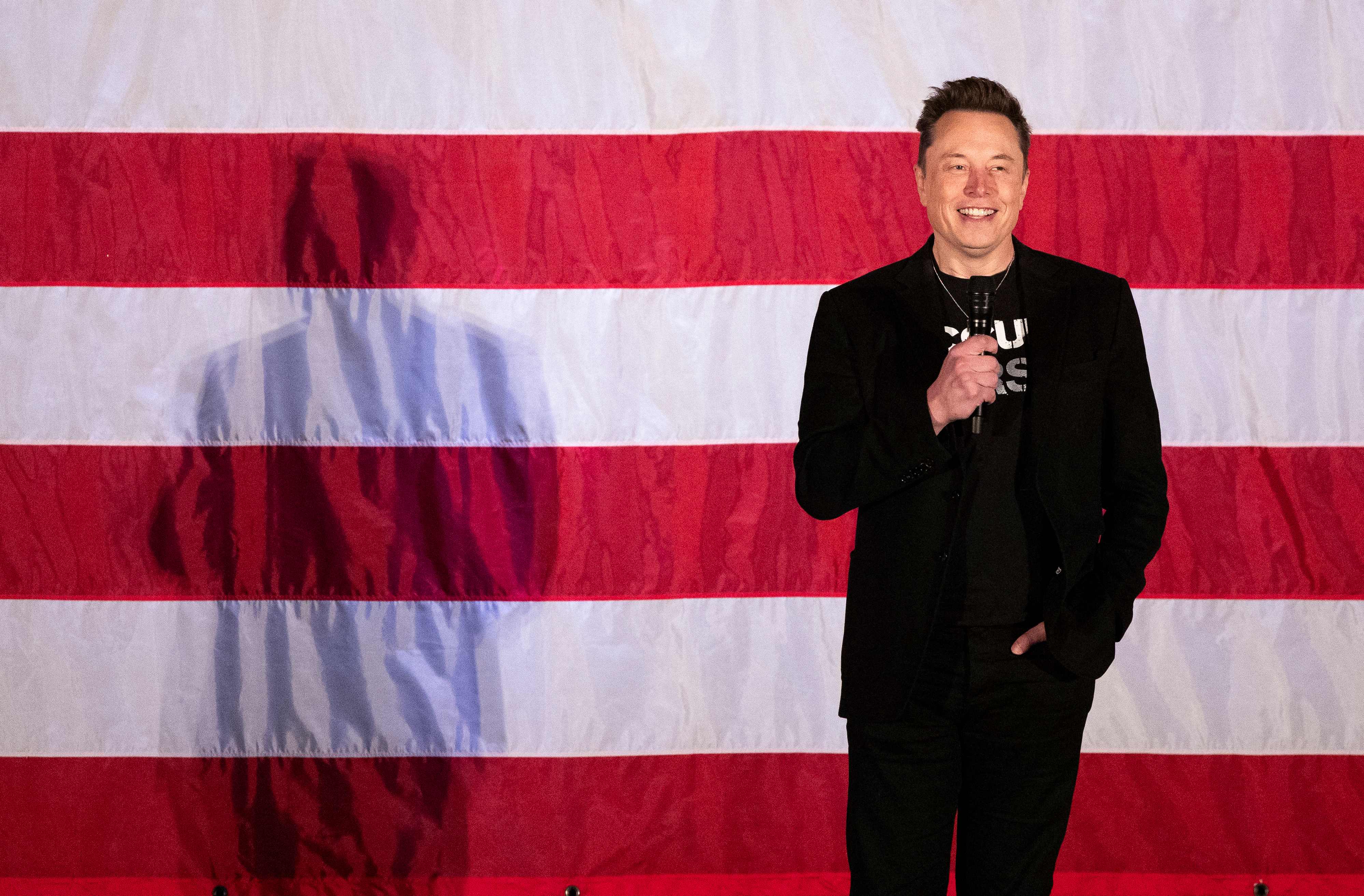 (FILES) Tesla and SpaceX CEO Elon Musk speaks during a town hall event hosted by America PAC in support of former US President and Republican presidential candidate Donald Trump at the Greater Philadelphia Expo Center in Oaks, Pennsylvania, on October 18, 2024. Donald Trump will be the one taking the presidential oath next week, but in some respects, billionaire Elon Musk might as well place his hand on the Bible too.  In an unprecedented relationship for modern US history, Trump will be heading into the White House shadowed by an advisor who is not only the world's richest person but matches the incoming president in terms of wild ambition, hard-right politics, and media influence. (Photo by RYAN COLLERD / AFP)