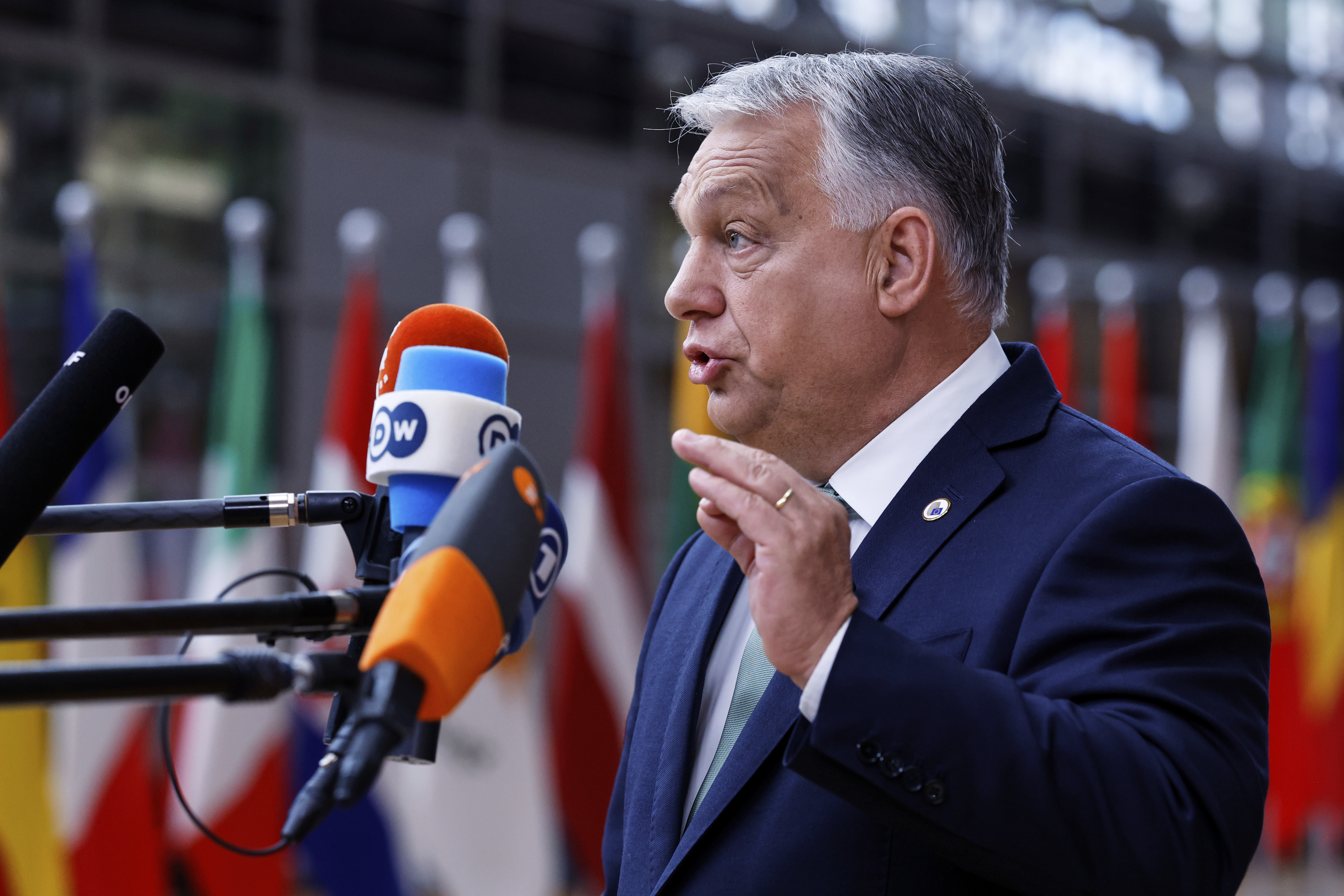 Hungary's Prime Minister Viktor Orban speaks with the media as he arrives for an EU summit at the European Council building in Brussels, Thursday, June 26, 2025. (AP Photo/Omar Havana)