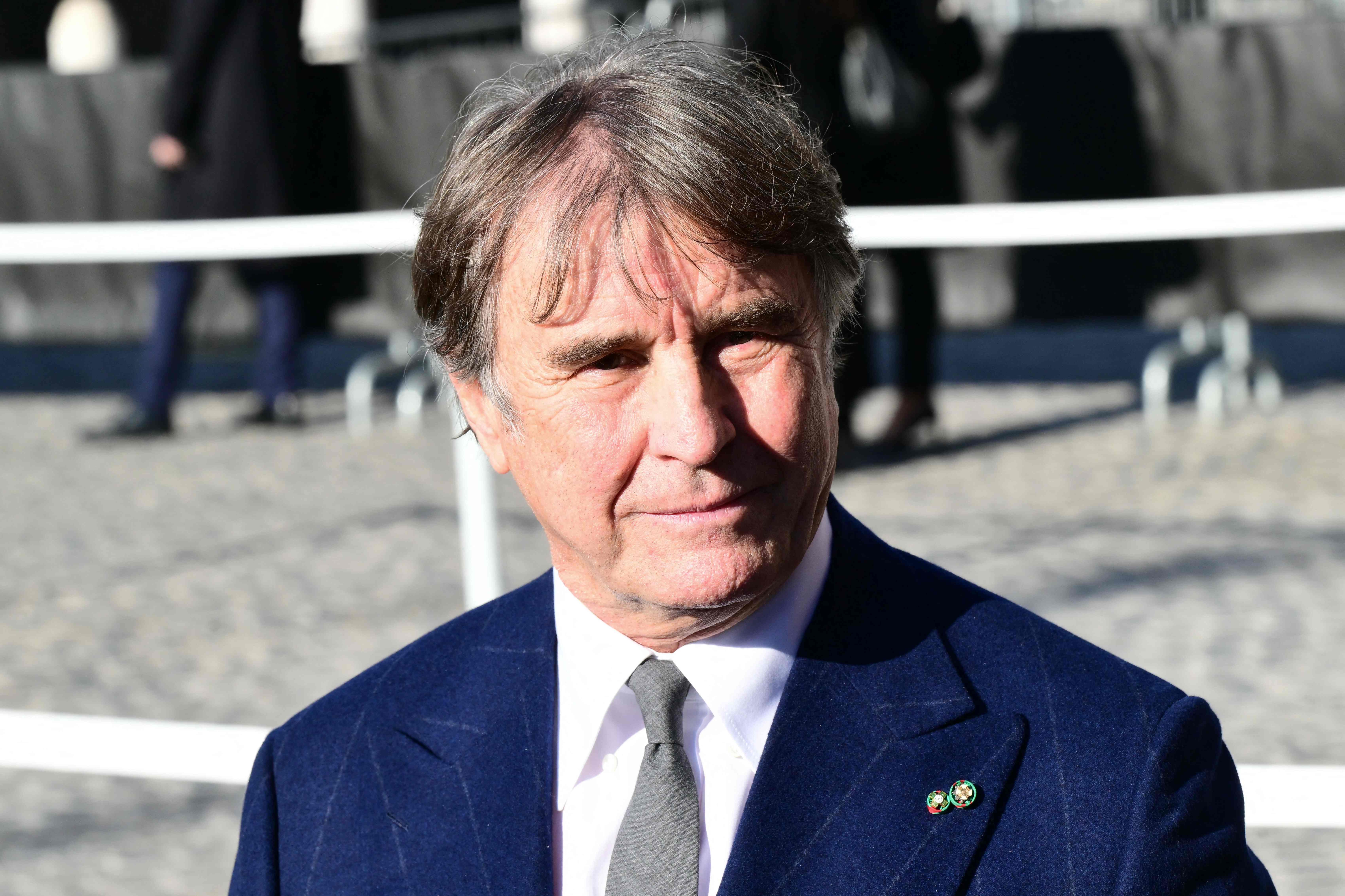 Italian creative director Brunello Cucinelli arrives at the funeral ceremony for the late Italian fashion designer Valentino Gavarani at the Basilic of Santa Maria degli Angeli e dei Martiri, in Rome on January 23, 2026. (Photo by Stefano RELLANDI...